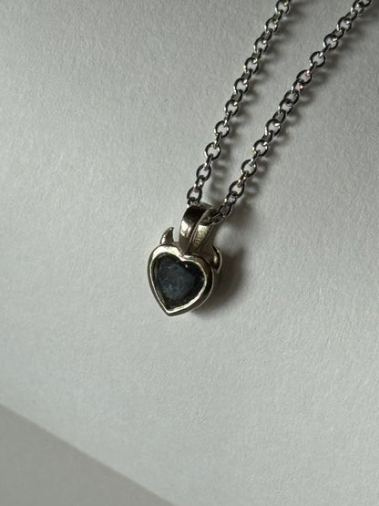 heart shaped salt and pepper diamond pendant with devil horns on a white background 
