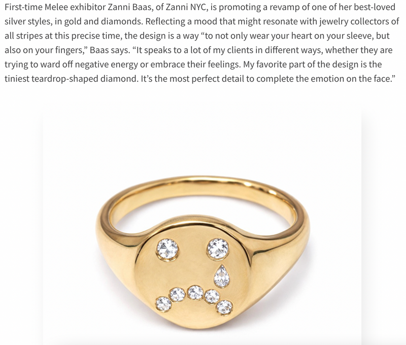 Gold ring with embedded diamonds on a white background