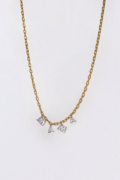 A gold chain with white diamond letter spelling out 'MAMA' on a white background