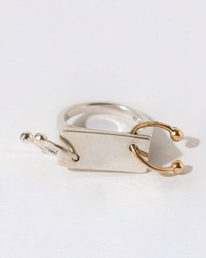Silver ring with two horseshoe piercing in silver and 14k yellow gold