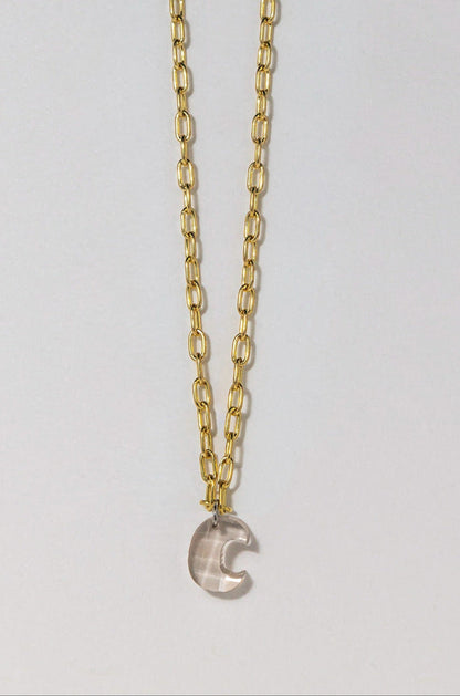 gold chain with white diamond letter 'C' on a white background